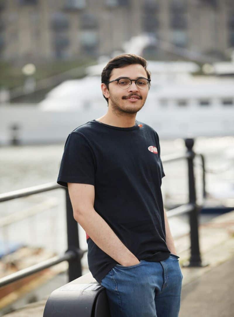 Student on bridge in Bristol
