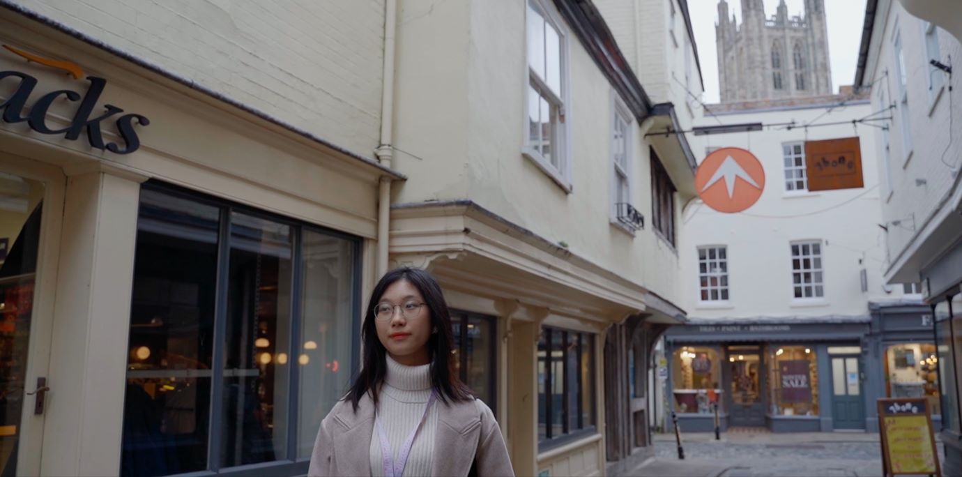 Student walking through canterbury